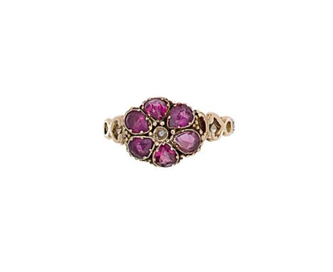 A 19th century fully hallmarked 12ct gold garnet and pearl cluster ring, central rubover set seed pearl, surrounded by six pe