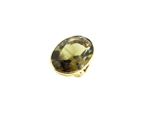 A 9ct gold large smokey quartz dress ring, rubover set oval faceted smokey quartz, 24 x 17.7mm, estimated approximate weight 