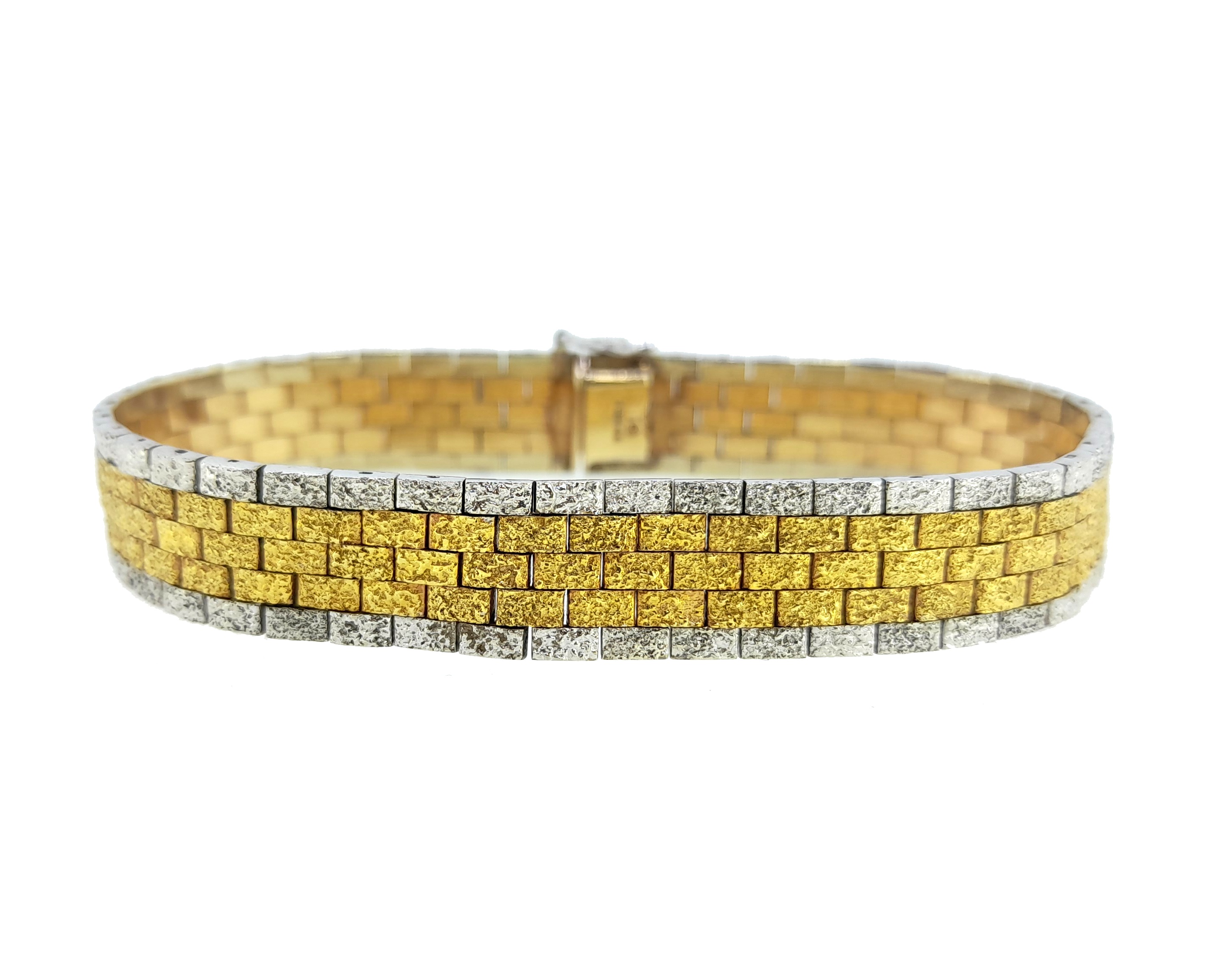 A late 20th century two colour gold brick link bracelet, in Cheffins
