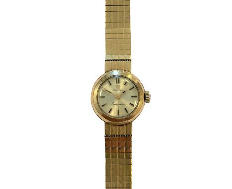 Omega - A lady's 9ct gold 'Ladymatic' wristwatch, circa 1961, the signed circular silvered dial, 14mm diameter, with gold and