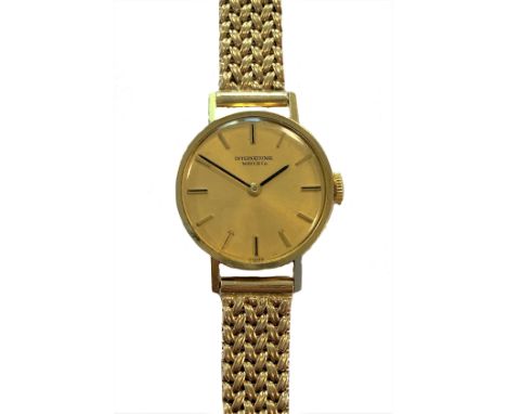 IWC - A lady's 18ct gold wristwatch on a later 9ct gold bracelet, circa 1968, the signed circular champagne dial, 20mm diamet
