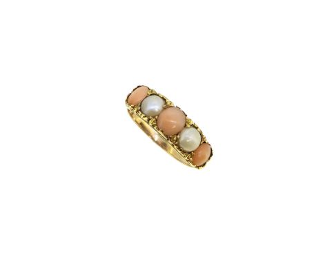 A pearl and coral five stone ring, carved half hoop style with a claw set central oval cabochon coral, 5.6 x 5mm, flanked by 