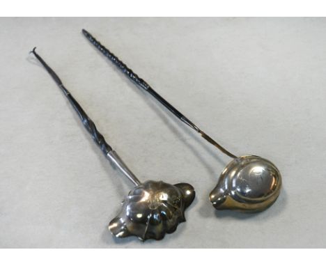 A George II silver punch ladle together with a George III example, the first with mark of Thomas Moore II, London 1758, flute