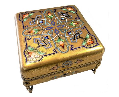 A gilt metal and enamel jewellery casket, unmarked, probably of French origin, of square form, the piano hinged beaded edged 