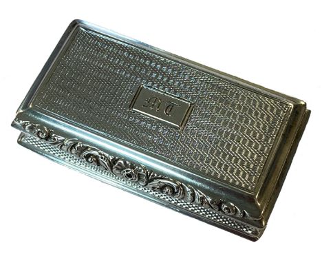 A George IV silver snuff box, probable mark of Joseph Taylor, Birmingham 1825, of rectangular form, engine turned all over wi