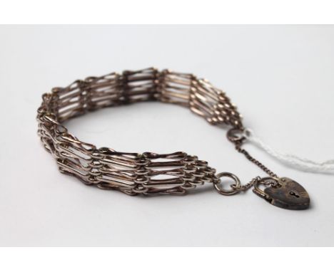 White metal gate bracelet with silver locket
