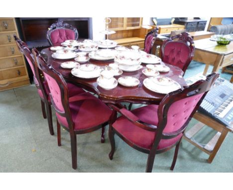 Table and six deep button backed red velvet type chairs 