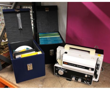 Eumig Mark 8S10 projector and two cases of 8 mm reels and can