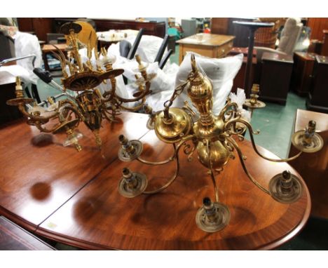 Two brass ceiling hung light fittings, one decorated with cherubs