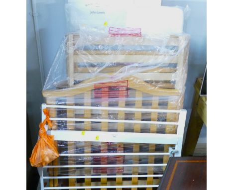 Unassembled child's cot, mattress and stair gate 
