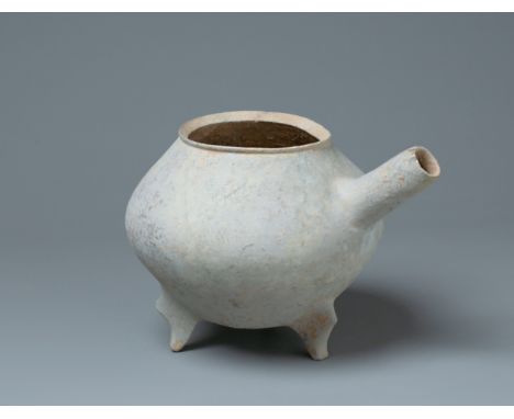 Height: 17.6cm, Length: 26cm The tripod body has a long pouring spout protruding from the ovate-form body Provenance: The Pro