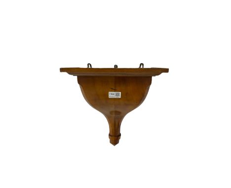 Fruitwood Wall Bracket, the dished and stepped moulded top over shaped and tapering body with canted corners W30cm