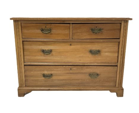 Edwardian satin walnut chest, the rectangular top over two short and two long drawers, raised on bracket supports W103cm