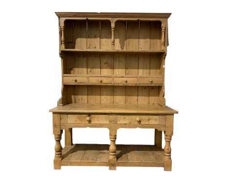 Victorian style pine dresser, the projecting cornice over two tiered plate rack with four spice drawers over base with two lo