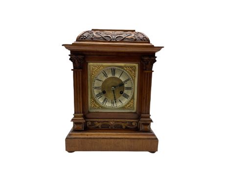 A German mantle clock in an oak case manufactured by HAC (Hamburg American Clock Company) c 1890, basket top with Arts and cr