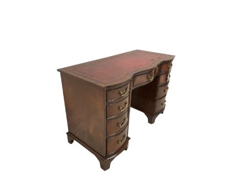 Bevan Funnell "Reprodux" - mahogany writing desk, serpentine top with inset leather, twin pedestal supports, fitted with nine