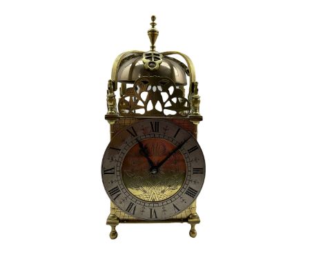 A 20th century spring driven table clock in the style of an early 17th century Lantern clock, with an eight-day striking move