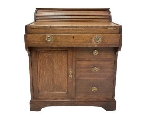 Christopher Pratt &amp; Sons, early 20th century roll top writing desk, the frieze drawer operating the roll top, opening to 