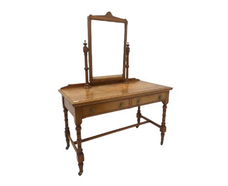 Victorian pine mirror back dressing table, the swing mirror over two drawers, raised on turned supports united by a stretcher