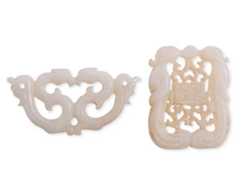 TWO RETICULATED JADE CARVINGS
One rectangular example bordered by two parrots, central lion face and pierced scrolling sectio