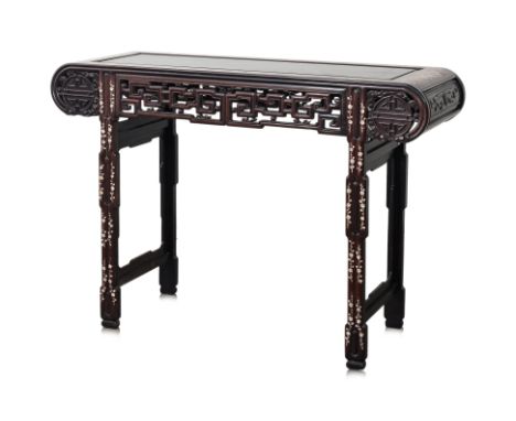 A CARVED AND MOTHER OF PEARL INLAID BLACKWOOD ALTAR TABLE
With mother of pearl inlaid decoration of birds, animals and flower
