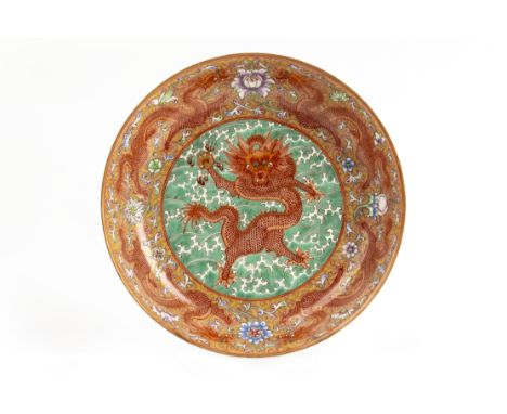 AN IRON RED AND GREEN ENAMELED DRAGON DISH Decorated with a central iron-red five-clawed dragon clutching a pearl, on a green