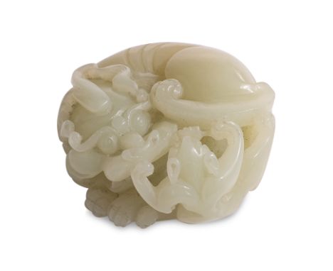 A PALE CELADON JADE CHILONG CARVING Qing dynasty, a reticulated roundel of two conjoined chilong, one larger and the other sm