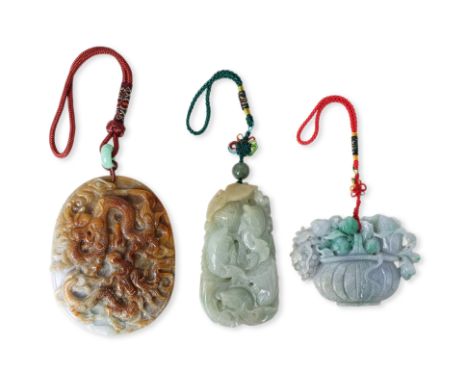 THREE CARVED JADEITE PENDANTS
20th century, three fish among aquatic foliage with lucky coins and ruyi to the reverse, a lave