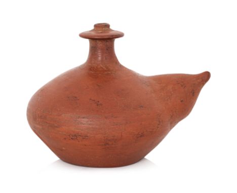 A SOUTHEAST ASIAN BURNISHED EARTHENWARE KENDI
Red earthenware, squat shaped body with mammiform spout, short neck and overhan