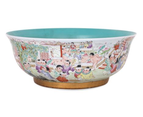A LARGE FAMILLE ROSE PORCELAIN BOYS BOWL
Large basin bowl with everted rim, decorated in 100 boys pattern, turquoise glazed i