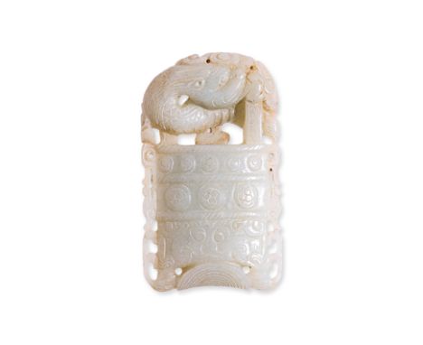 A JADE CARVING OF AN ARCHAISTIC BELL AND SERPENT Pale celadon jade carving of archaic form bell with a mythical serpent wrapp