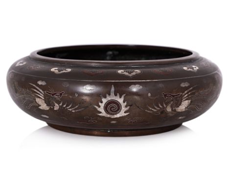 A SILVER AND COPPER INLAID BRONZE CENSER
Circa 19th century, squat form with rounded sides, decorated in twin dragon and phoe
