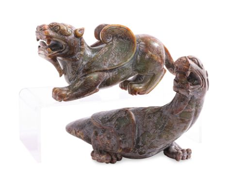 TWO SILVER INLAID JADE CARVINGS OF MYTHICAL BEASTS
20th Century, both of winged beasts, with silver inlaid archaic scroll dec