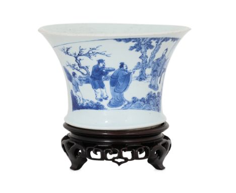 A BLUE AND WHITE PORCELAIN FLARED BRUSH POT Early Kangxi, waisted sides and flared rim, the walls decorated in scroll shape p