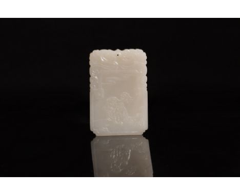 A WHITE JADE PENDANT PLAQUE Rectangular jade plaque decorated in scene of two children and a lotus, serpent dragons to the to