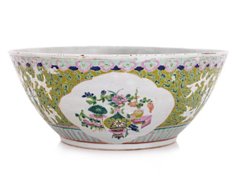 A LARGE FAMILLE ROSE PORCELAIN BASIN
Late Qing, exterior body of lime-green ground interspersed with dark green foliage, deco
