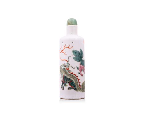 A FAMILLE ROSE PORCELAIN 'BUDDHIST LIONS' SNUFF BOTTLE Guangxu period, cylindrical bottle of white ground decorated in three 