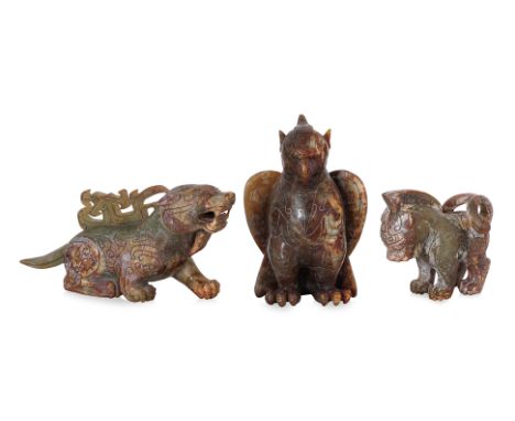 THREE SILVER INLAID JADE / HARDSTONE MODELS OF MYTHICAL BEASTS
20th Century, all inlaid with archaic scroll decoration
The ea