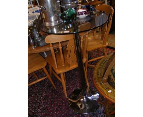 A glass and chrome bar table - 59cm diameter x 106cm high 