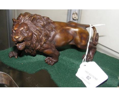 A bronze style lion -15cms long