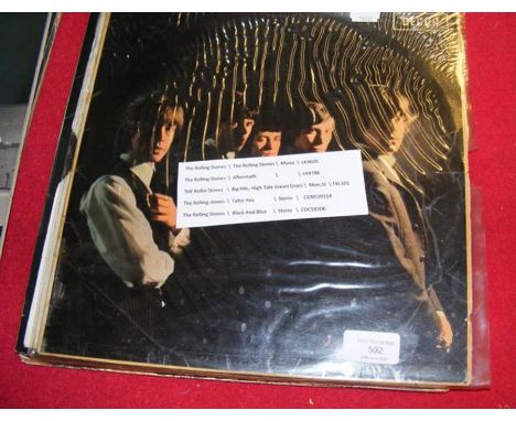 A vintage Rolling Stones album together with four others