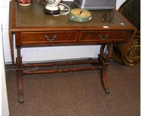 A sofa table with inset green leather top - width 194cm 