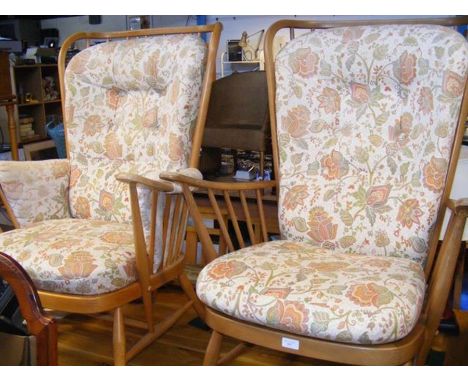 A pair of Ercol wing back armchairs 