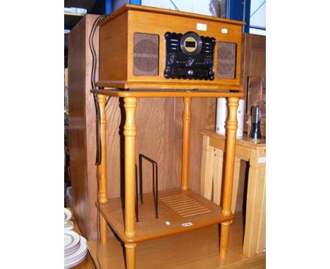 A reproduction record and CD player, together with music stand 