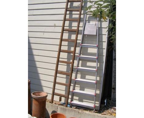 A vintage wooden ladder and an aluminium step ladder