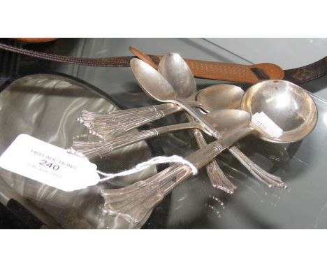 The matching teaspoons and ladle
