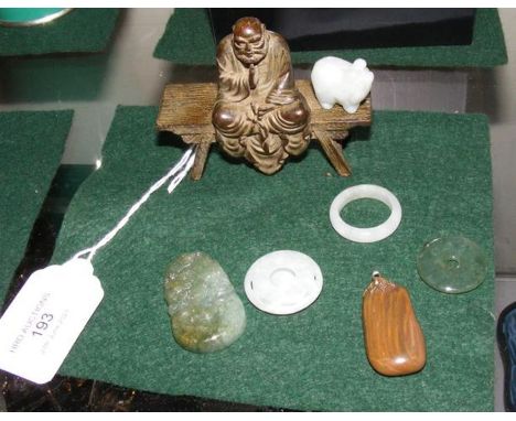A small jade pendant etc.