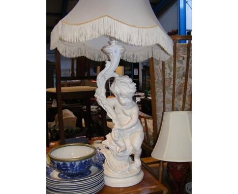 A large table lamp of cherub form 