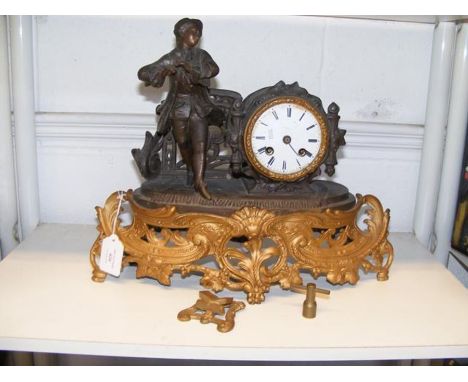 A cast metal continental mantel clock (requiring restoration) 