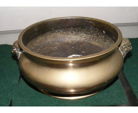 An antique Chinese bronze bowl with mythical beast handles to the side - 18cm diameterCONDITION REPORTWe have attached a numb